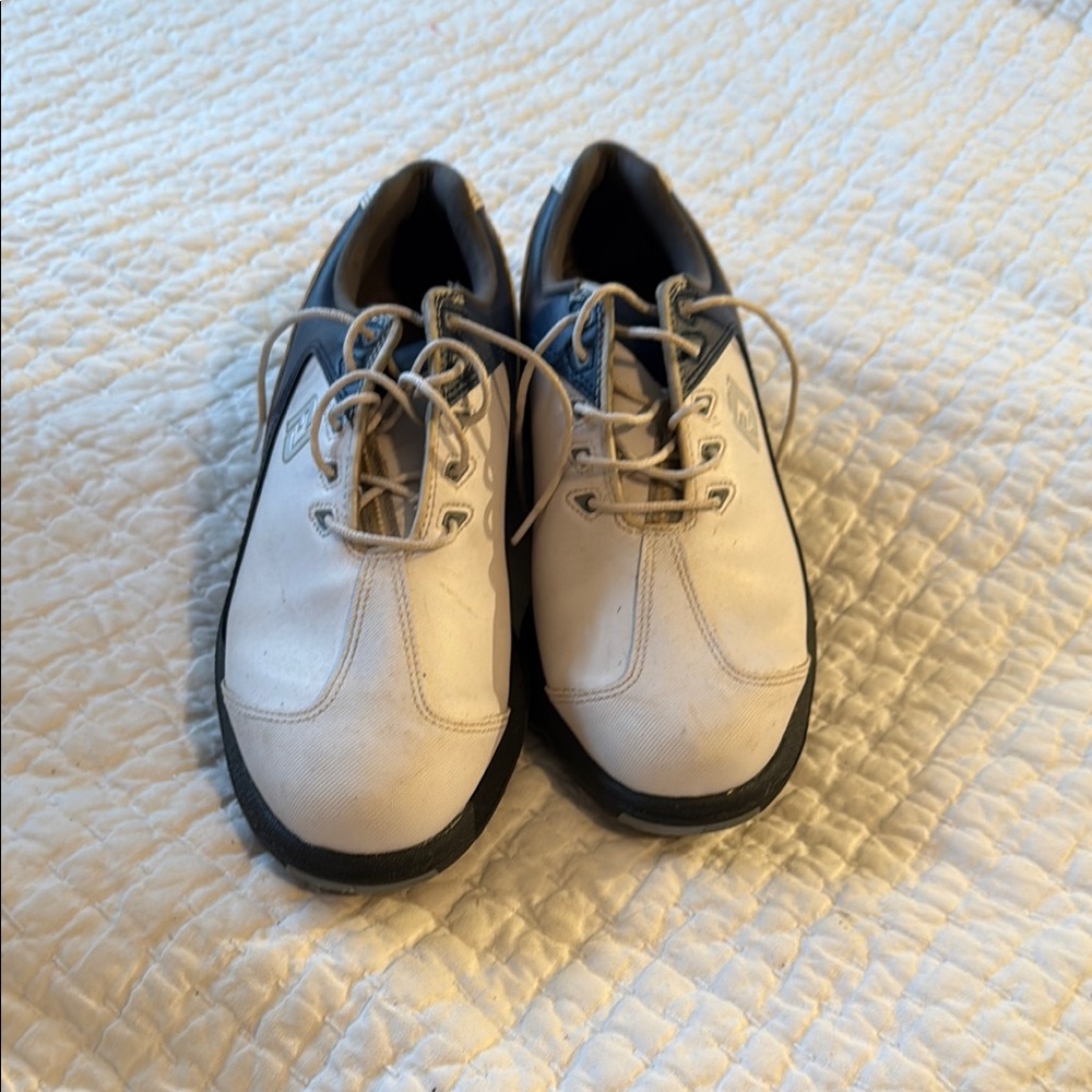 FootJoy golf shoes with spikes.